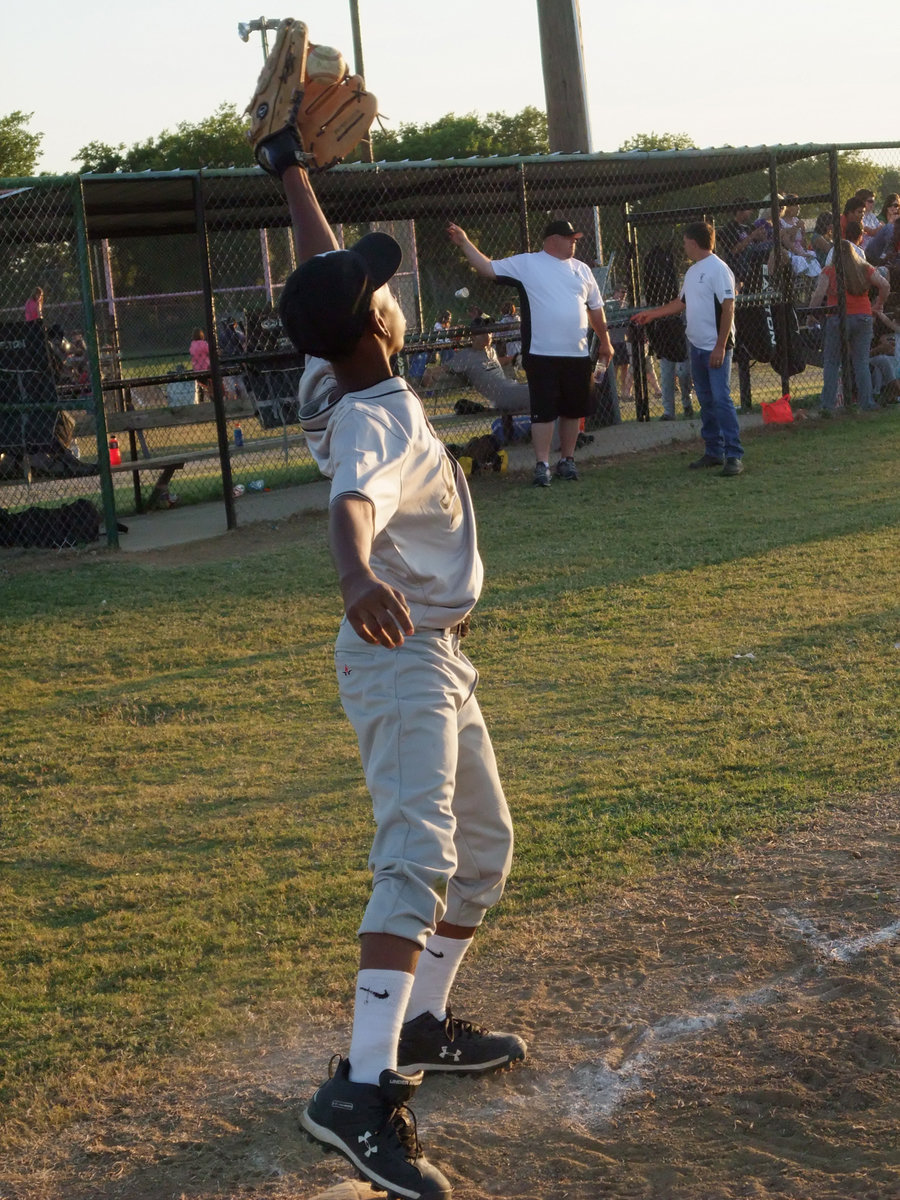 Image: Eric Carson catches — Eric Carson, flashes of brilliance admist a hitting storm turned in by IYAA batters.