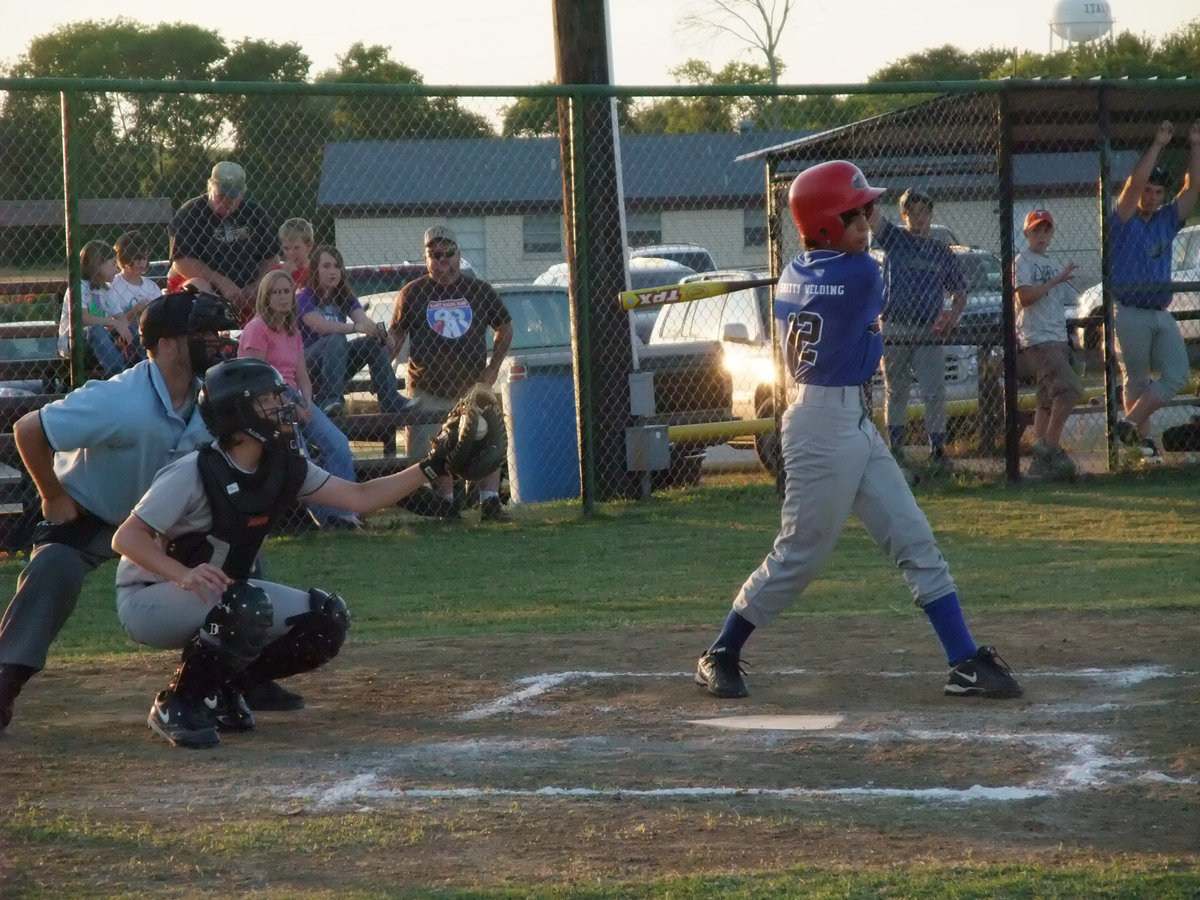 Image: Strike! — Justin wood pitches a strike right to Jacob’s mit.