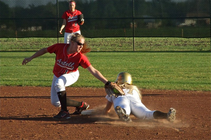 Image: Italy’s Megan Richards(17) slides under the tag at second base — Megan Richards(17) slides in safe at second base during a home game against Axtell. Italy defeated the Lady Longhorns 10-3.