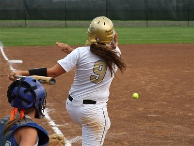 Image: The hits continue — See what I mean? Alyssa Richards(9) hammers a liner into the gap.