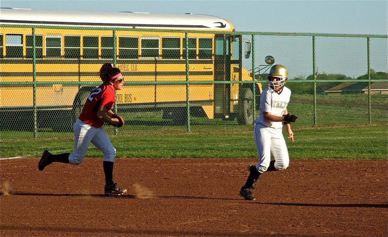 Image: Run, Bailey, run! — Caught in a rundown against Axtell, Bailey Bumpus makes it back to second base…barely.