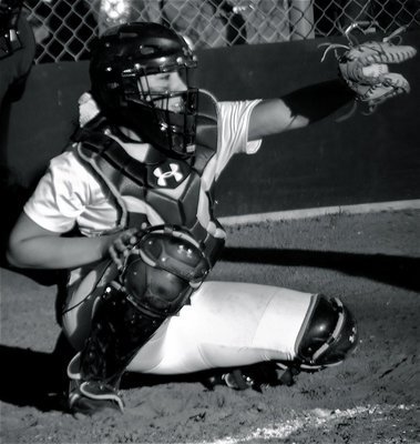 Image: Behind the plate — Alyssa Richards holds onto a strike from sister, Megan Richards.
