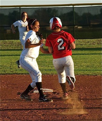 Image: Easy pickings — Left Fielder, Breyanna Beets, backs up teammate, Anna Viers, who catches the throw from catcher, Alyssa Richards, in time to make the tag at second against Axtell.