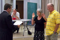 Image: Oath — Justice of the Peace Jackie Miller Jr. administered the oath of office to Marty Haight and Cheryl Owen.