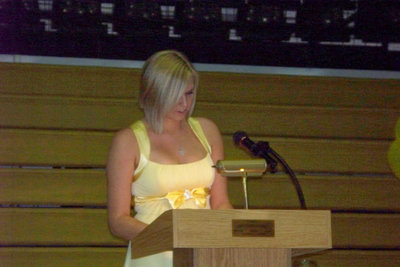 Image: Megan Hopkins speaks — Megan announces the Fortnightly Club award recipient is Kelli Strickland.