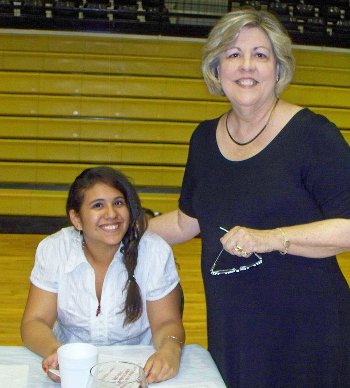 Image: Susana and Mrs. Hyles — Ann Hyles, in her 38th year as the Family Consumer Sciences Teacher, congratulates Susana Ramos on receiving the Sandi Paiano Award. “Sandi was a sweet, sweet girl who did everything with vigor and school spirit.”