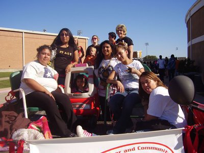 Image: We got spirit! — Remember our Homecoming float? Little Anna was cruising that day!