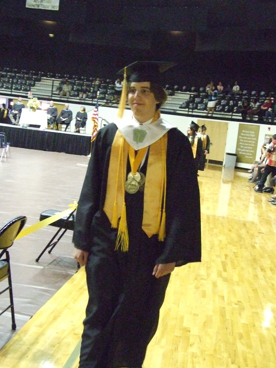 Image: Tyler processes — Tyler Boyd and his classmates walk out to Pomp and Circumstance.