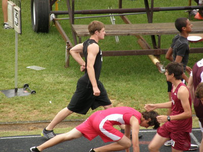 Image: Ryan Ashcraft — Ashcraft stretches out before his big race at the Regional Track &amp; Field meet at Palestine.
