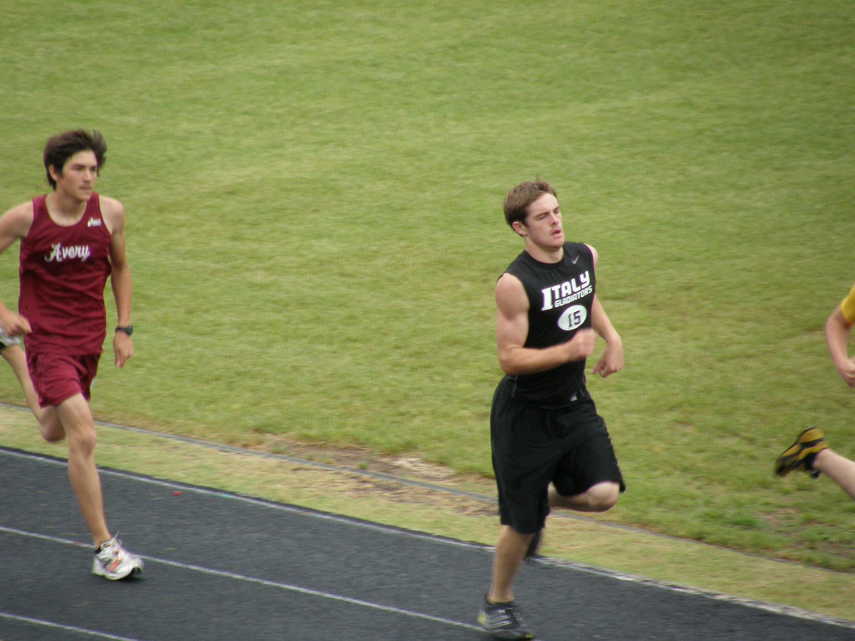 Image: Ryan rambles — Ryan Ashcraft muscles all the way to the finish line turning in a strong showing while representing IHS in Palestine.