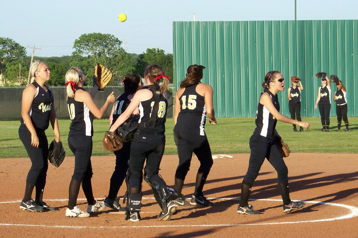 Image: Team Work! — During their pre-defense ritual, the Lady Gladiators get pumped up.