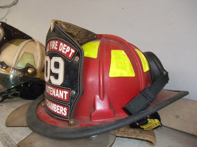 Image: Valuable equipment — The most valuable piece of equipment to a fireman is his fire helmet. However, a complete bunker set (boots, gloves, coat, pants, shield and helmet) total 6,500.00.