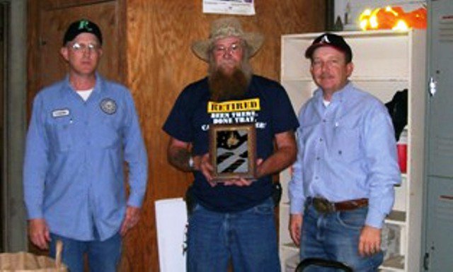 Image: Johnny Hanes honored at luncheon — Pictured (l-r):  Lonnie Reavis, Johnny Hanes and Commissioner Heath Sims