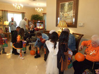 Image: Residents handing out candy