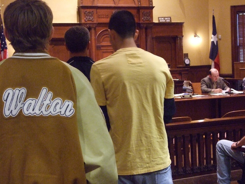 Image: Official Proclamation — Heath Sims, the Ellis County Commissioner Precinct 3, delivers a “Proclamation” on behalf of the 2009 Italy Gladiators Boys Basketball Team as the players and coaches stand at attention.