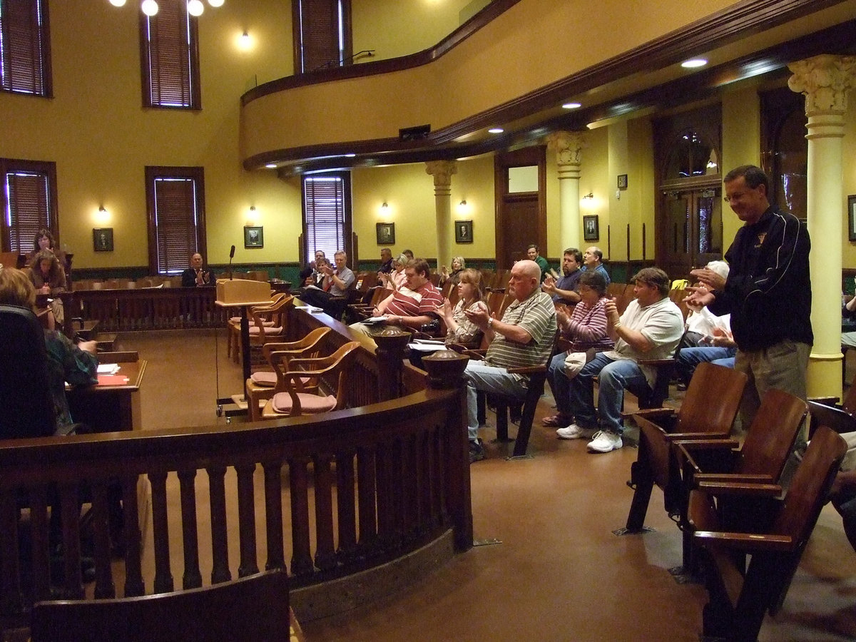 Image: Coaches Speech — Italy Head Coach Kyle Holley speaks to the Commissioners Court on behalf of his team.