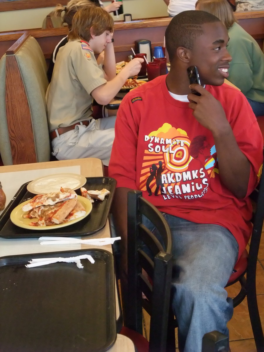 Image: Def. Player Of The Year — Defensive Player of the Year, Jasenio “Beast” Anderson, keeps a protective eye on patrons, ready to defend his plate like he did his team’s basketball goal.