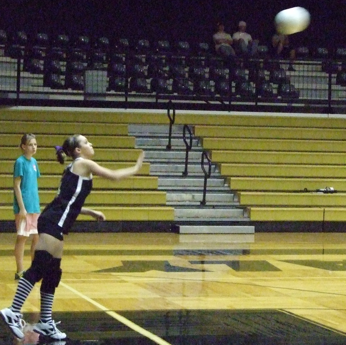 Image: Serve up — Junior, Drew Windham serves the ball.