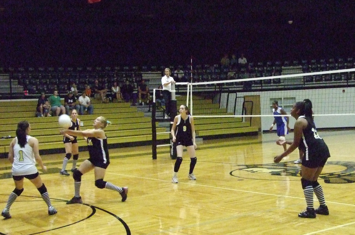 Image: Richards saves — Freshman, Megan Richards saves the serve.