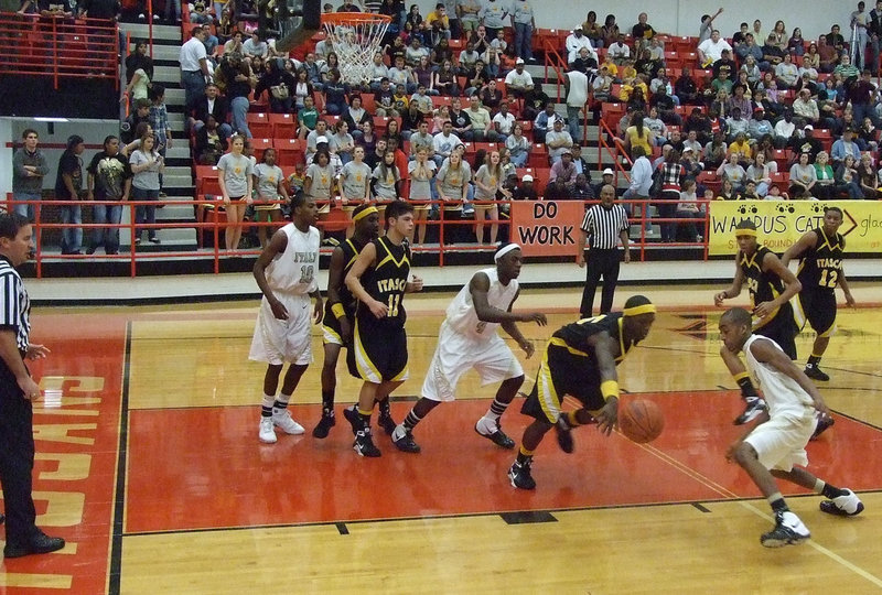 Image: Cat And Ball — Italy’s #2 Heath Clemons tries to take a Wampus Cat’s ball away from him.