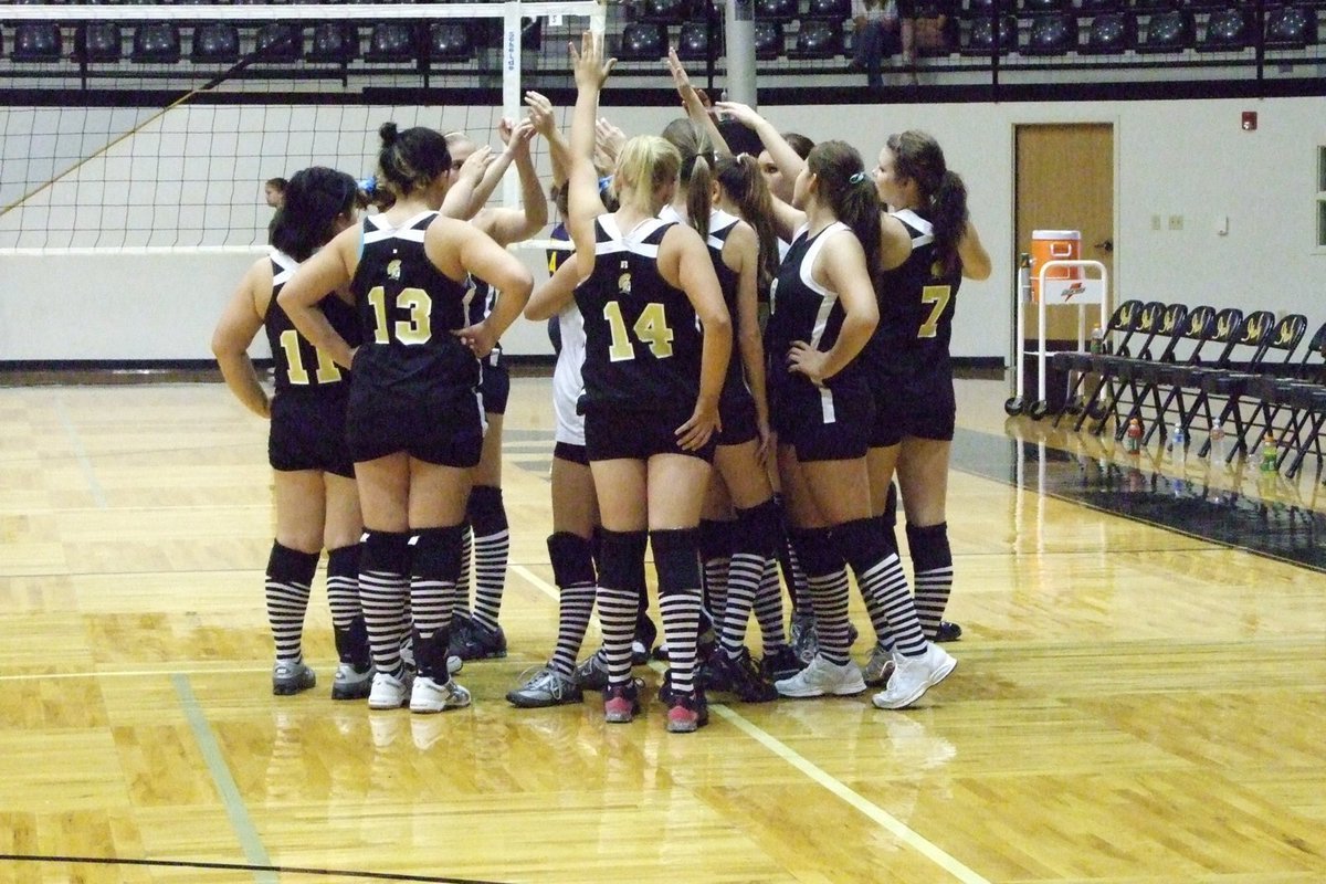 Image: Lady Gladiators huddle — Everyone came together for the win.