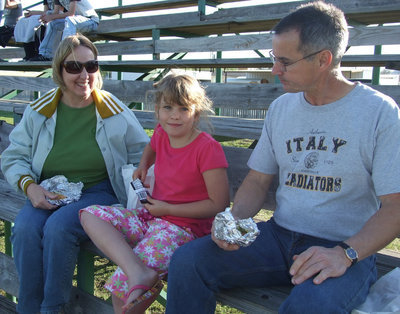 Image: Have you enjoyed a hotdog today? — Kim, Stephen and Jill Varner had to have Crackerjacks and a dog after the pitch.