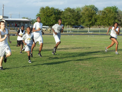 Image: Chariots of fire — Gladiators climb on their chariots of fire as they get warmed up for the District meet.