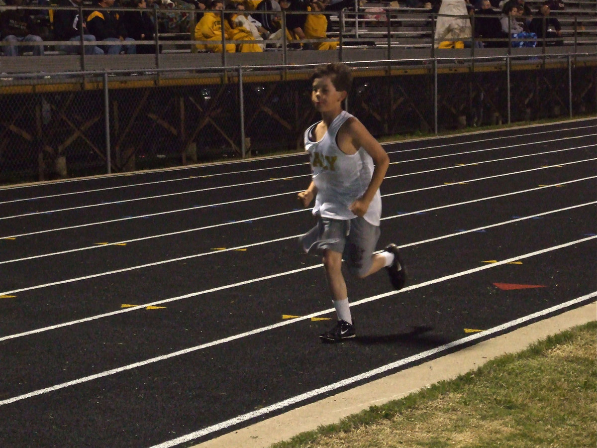 Image: “Mac-Mac” Trucking — “Mac-Mac” Surles rolls down the lane like a runaway 18-wheeler claiming 5th place in the 2400 meters.