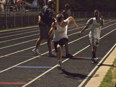 Image: Eric hands off to Justin — Similar to this past football season, Eric “Flash” Carson hands off to Justin “Woosh” Wood during their 7th grade relay event.