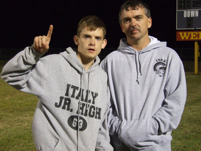 Image: Justin with Dad — Gary Wood was proud of his son Justin who won 1st Place in both the long jump and triple jump.