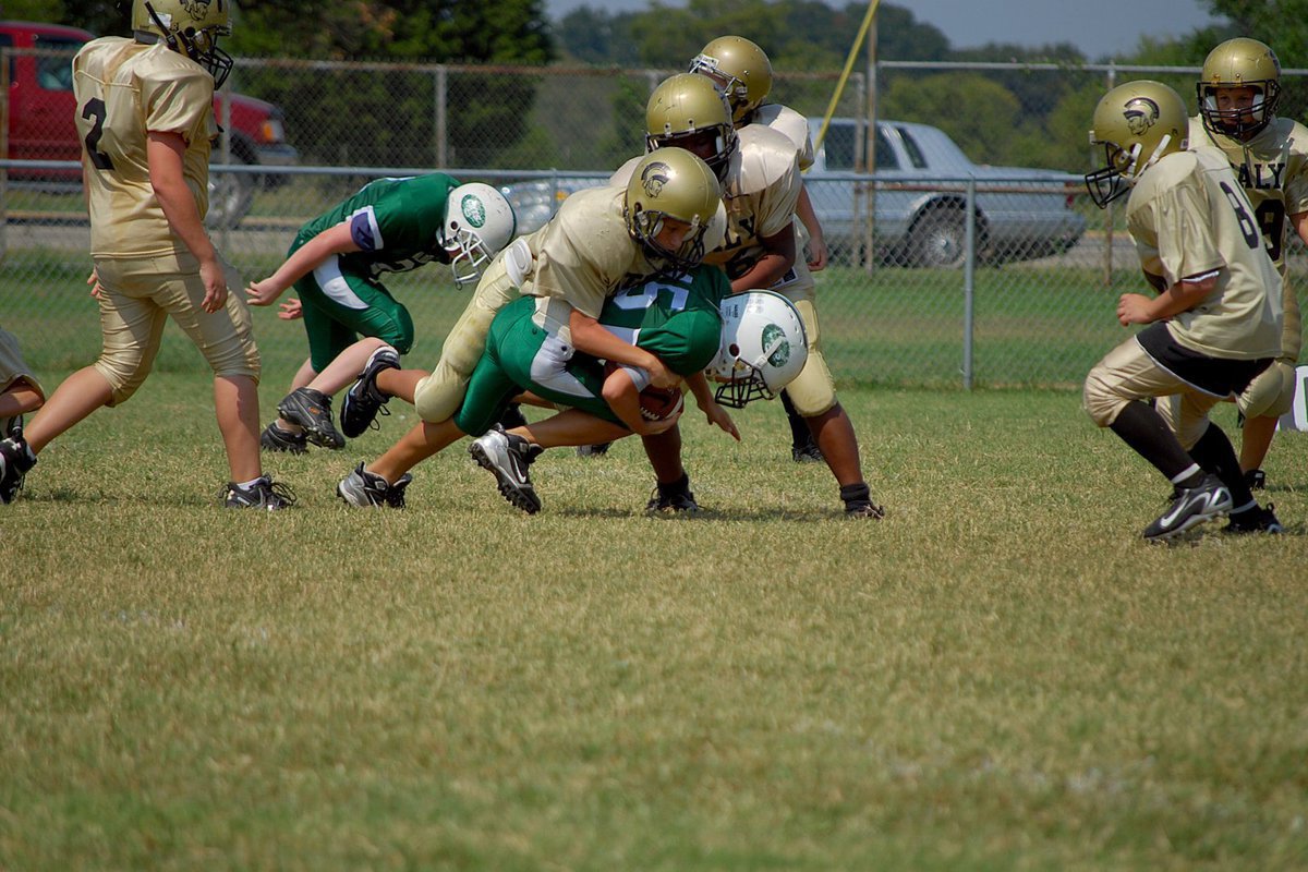 Image: Swarming “A” team defense — The Gladiators defense tried to be strong against the Wildcats.