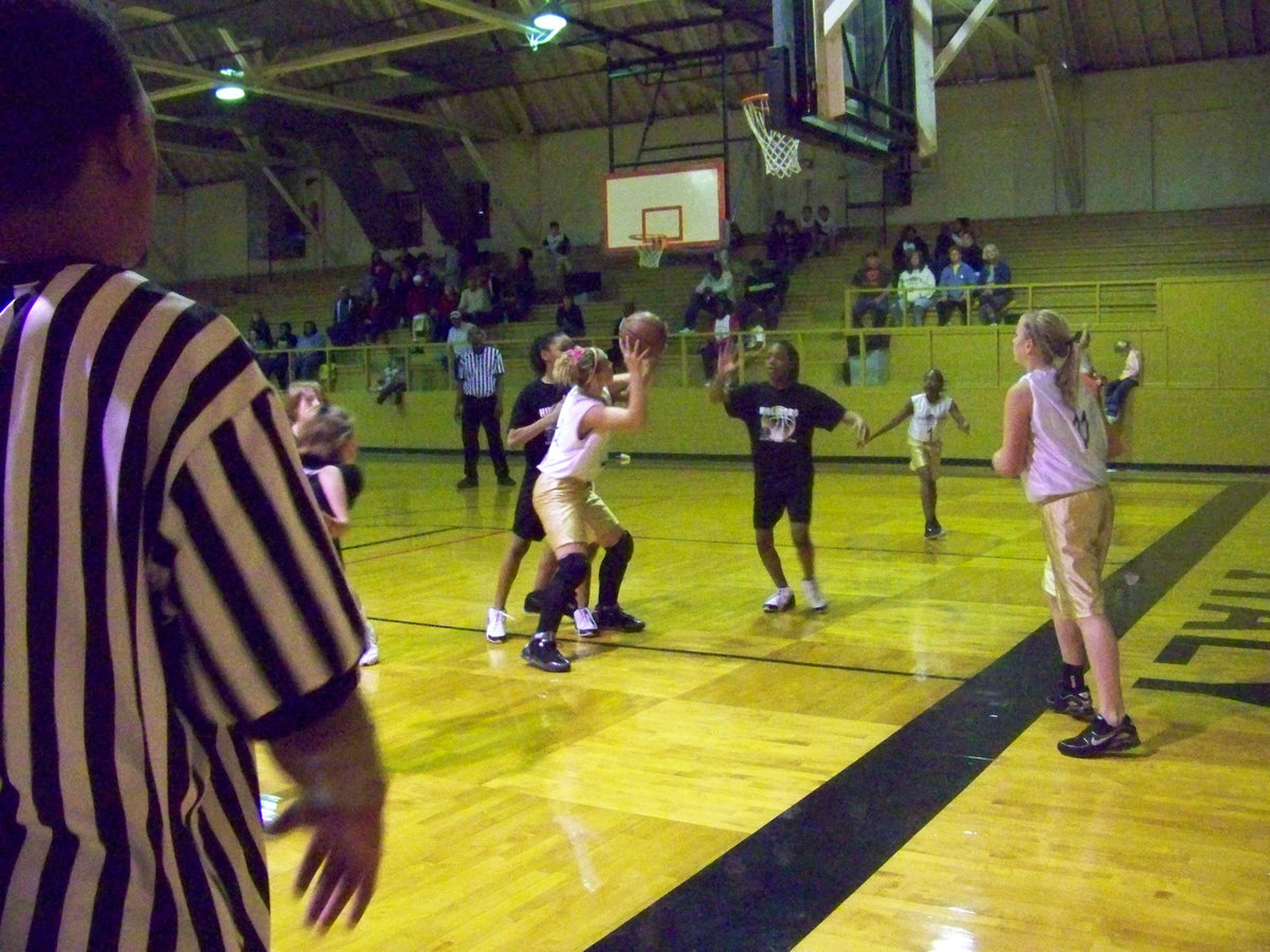 Image: Maddy to Jac — Sure passer #11 Madison Washington patiently waits for #22 Jaclynn Lewis to get open before passing her the ball. Lewis scored 2 of her 7-points to lead all scores.