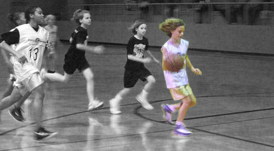 Image: Goodwin goes distance — McKenzie “Good win” Goodwin leads the “Girls In Gold” on the fast break. McKenzie also scored her 1st free throw during the game.