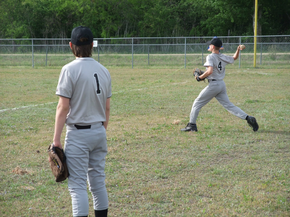 Image: Jacob &amp; Justin — The players try to get loose before their first game of the 2009 season.