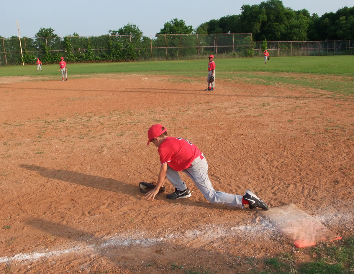 Image: Got it! — Italy’s infield warms up before the umpire yells, “Play ball!”