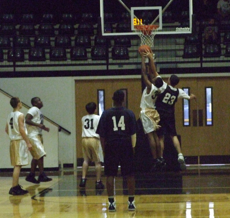 Image: Paul powers — Paul Harris #34 stretches out for the rebound as Tony Wooldridge, Adrian Reed and Brandon Jacinto keep their eyes on the ball.