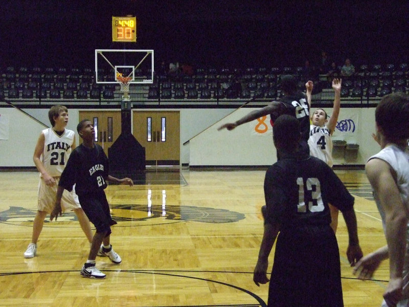 Image: In your face — Tony Wooldrige #4 hits a 3-pointer with a hand in his face.