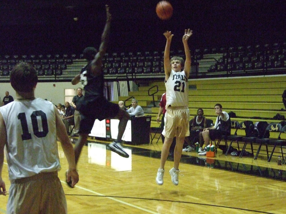 Image: Hopkins heaves — Avoiding the blocker, Cole shoots another 3-pointer.