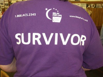 Image: Survivor shirt — Karen Mathiowetz wearing her Relay for Life “Survivor” shirt. Karen, a veteran in the battle against cancer, now fights for others whenever she can.