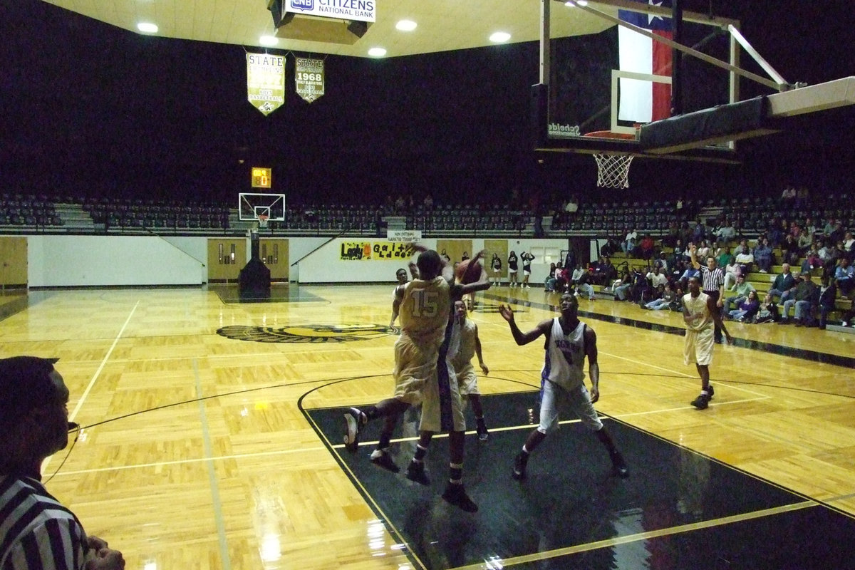 Image: Defending The Basket — Italy tries to defend the basket and deny Trinity Christian points in the paint.