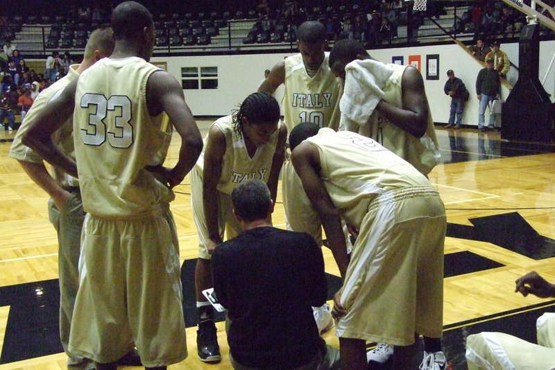 Image: Coach Holley Draws A Play — Italy’s Head Coach Kyle Holley draws a play to give his players a chance against an experienced Trinity Christian squad in the Tournament Championship game hosted by the Gladiators.