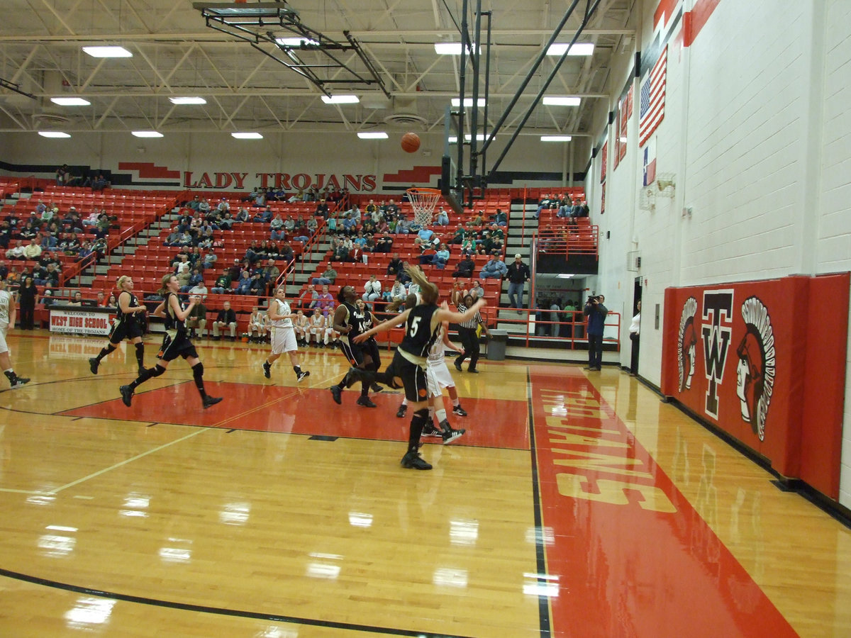 Image: DeMoss is fouled — Italy’s Becca DeMoss gets fouled as she drives to the basket against Valley Mills.