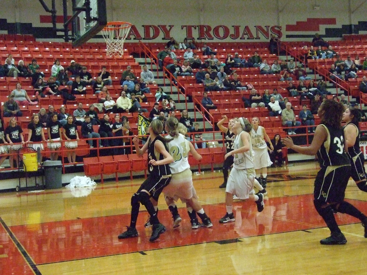 Image: Rossa blocks out — Italy’s #3 Kaitlyn Rossa tries to get into position to claim a rebound for the Lady Gladiators as #22 Megan Richards shoots over the top.