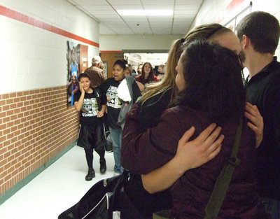 Image: The final walk — Senior Becca DeMoss gets a hug from her sister Grace while Sa’Kendra Norwood tries to console Marisela Perez as the players exit the West High School Gym knowing that the 2009 season, as well as the quest for a State title, has ended.