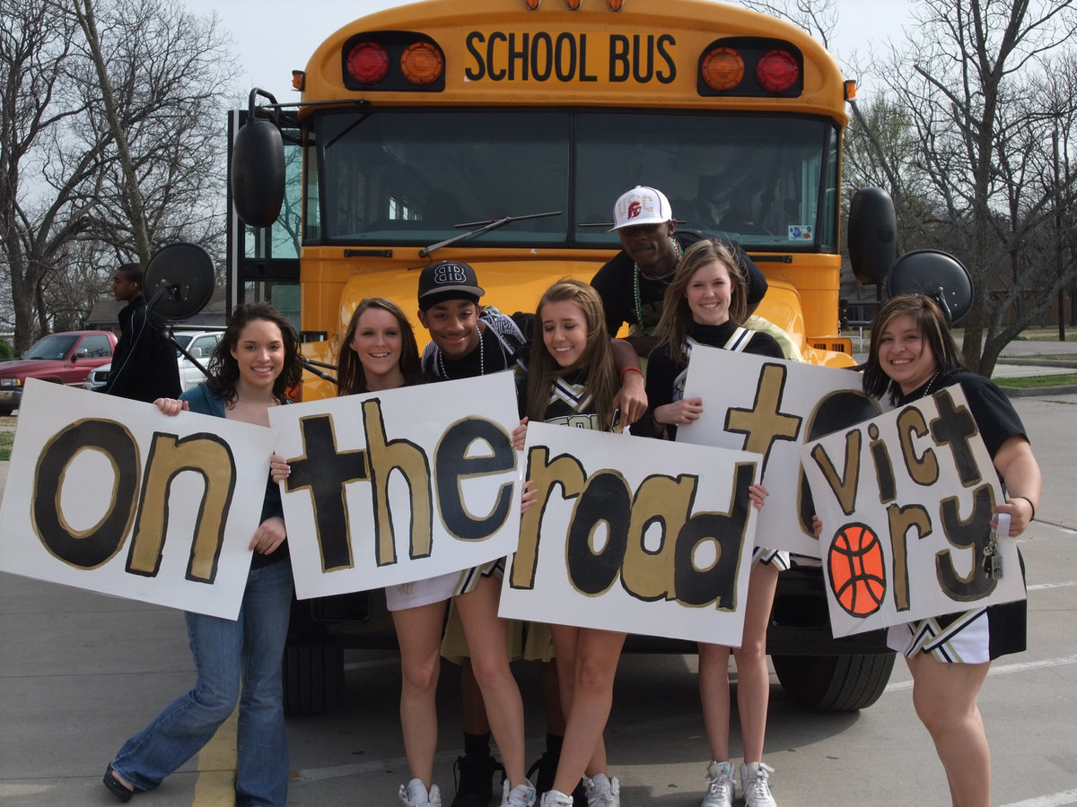 Image: On the road to victory — Dontavius and Diamond, along with the “Spirit Squad,” show Gladiator fans where the team is headed.