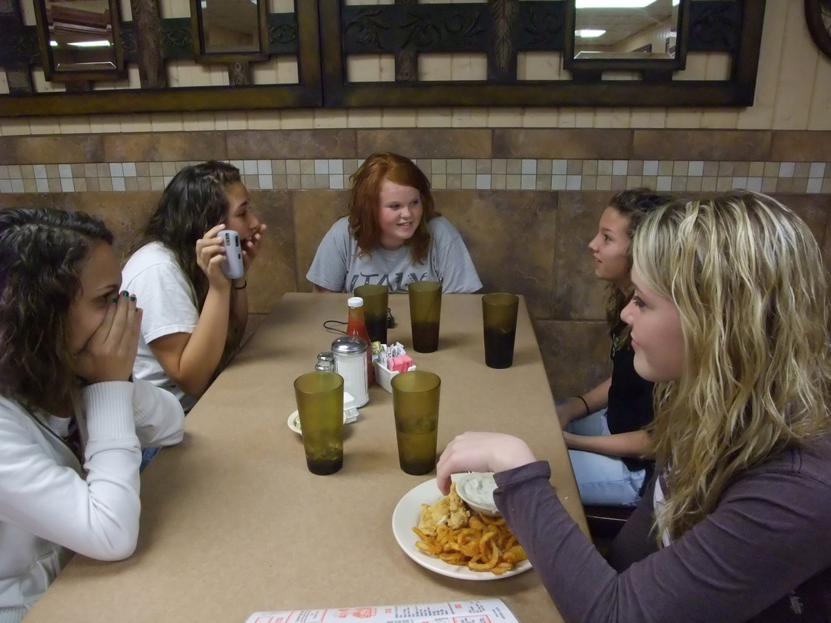 Image: Road trip! — Anna, Alyssa, Katie, Morgan and Shelbi share some laughs before the Gladiators served Menard a 65-56 loss.