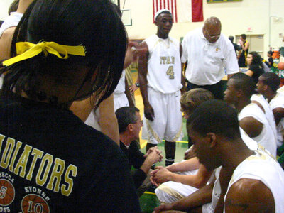 Image: Critical moment — Coach Holley settles his players as they prepare to finish off the Yellow Jackets.