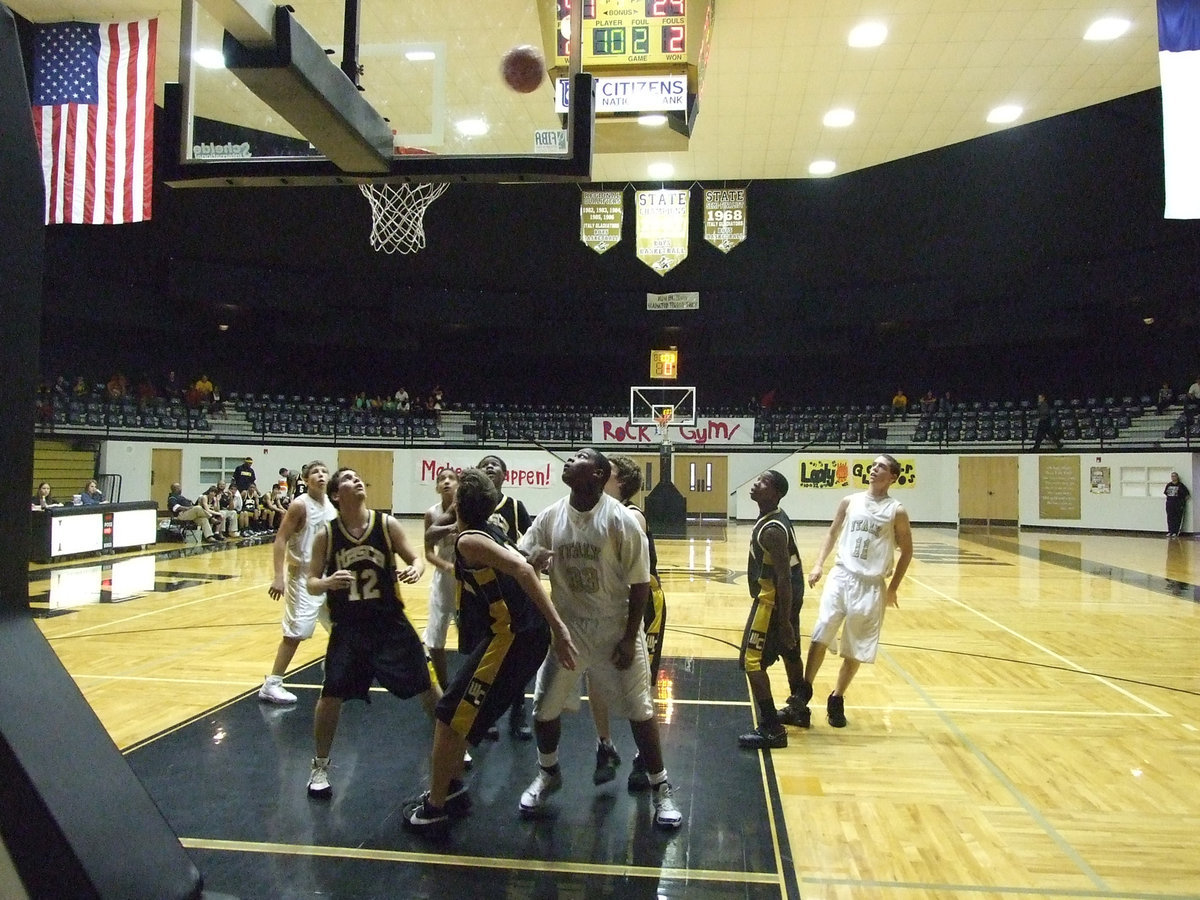 Image: Souder shoots — Italy’s #11 Brandon Souder releases a shot just outside the lane against Itasca.