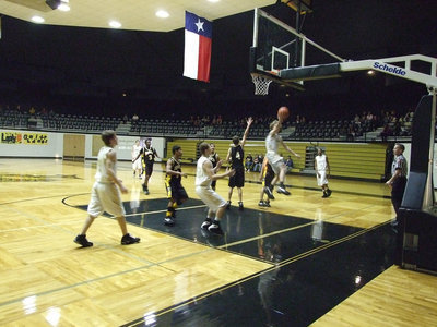 Image: Colton scores — Colton Campbell #5 penetrates past the Wampus Cats for a layup.