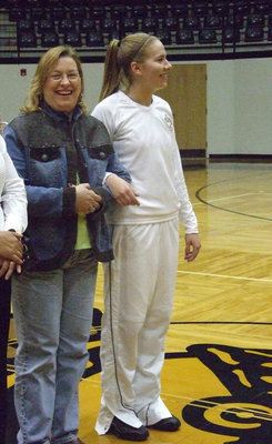 Image: What a pair — Shy Senior, Becca DeMoss, is escorted by her unshy mom, Anne Sutherland, on Senior Night. It was all fun and games until the tears started flowing.